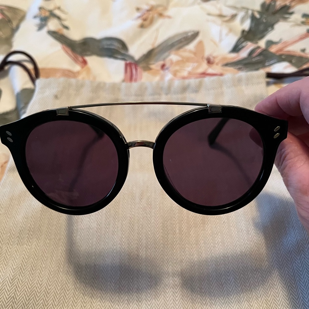 Stella McCarthney black round sunglasses.